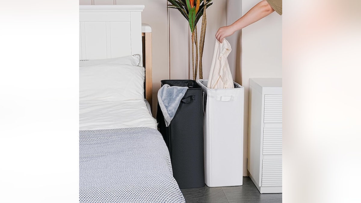 This narrow hamper fits beside a dorm bed.
