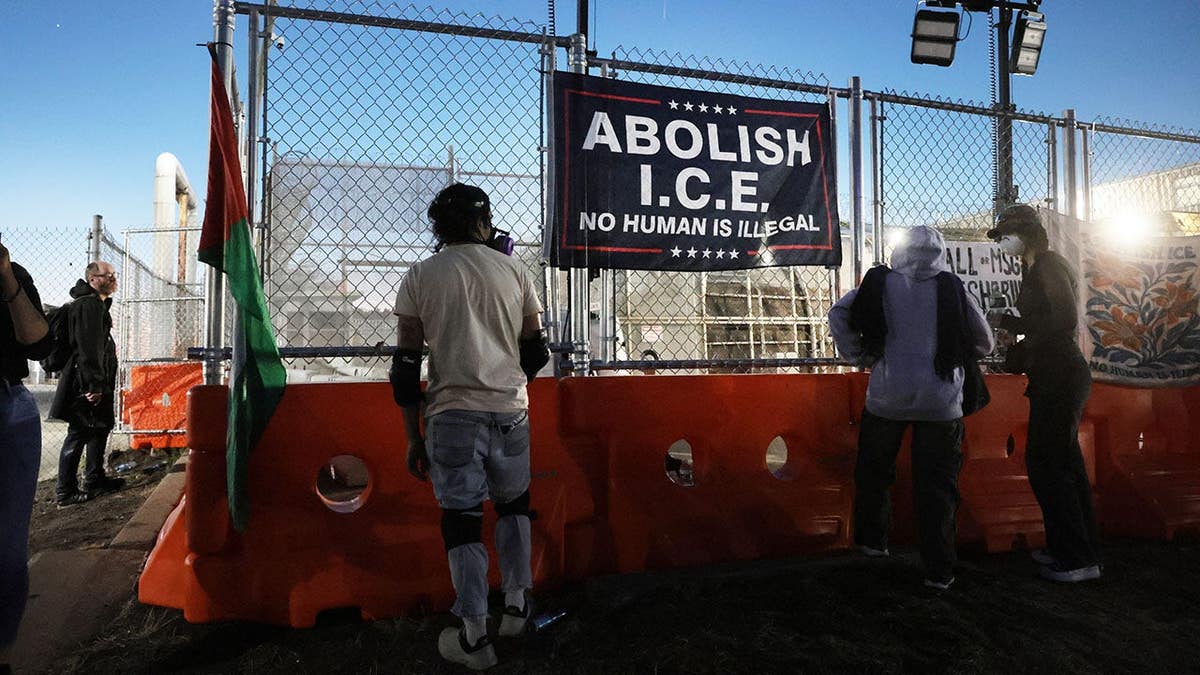 abolish ICE sign hangs outside Delaney Hall