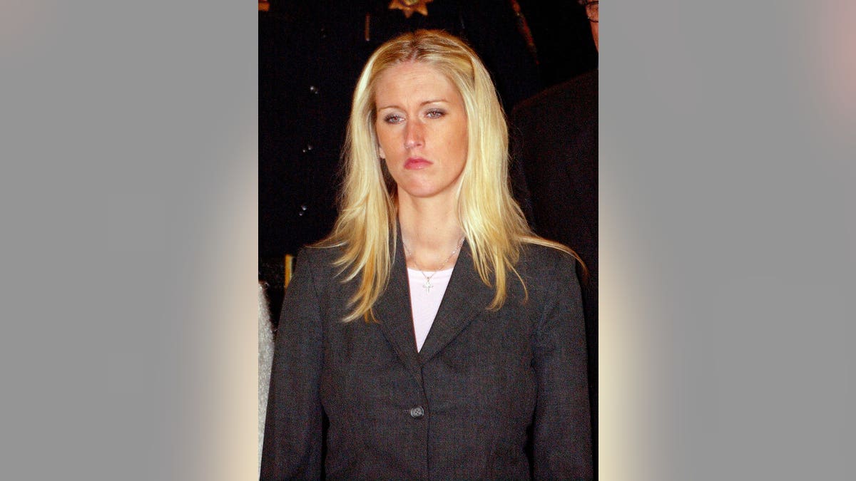 Amber Frey leaves a courtroom in Redwood City, California.