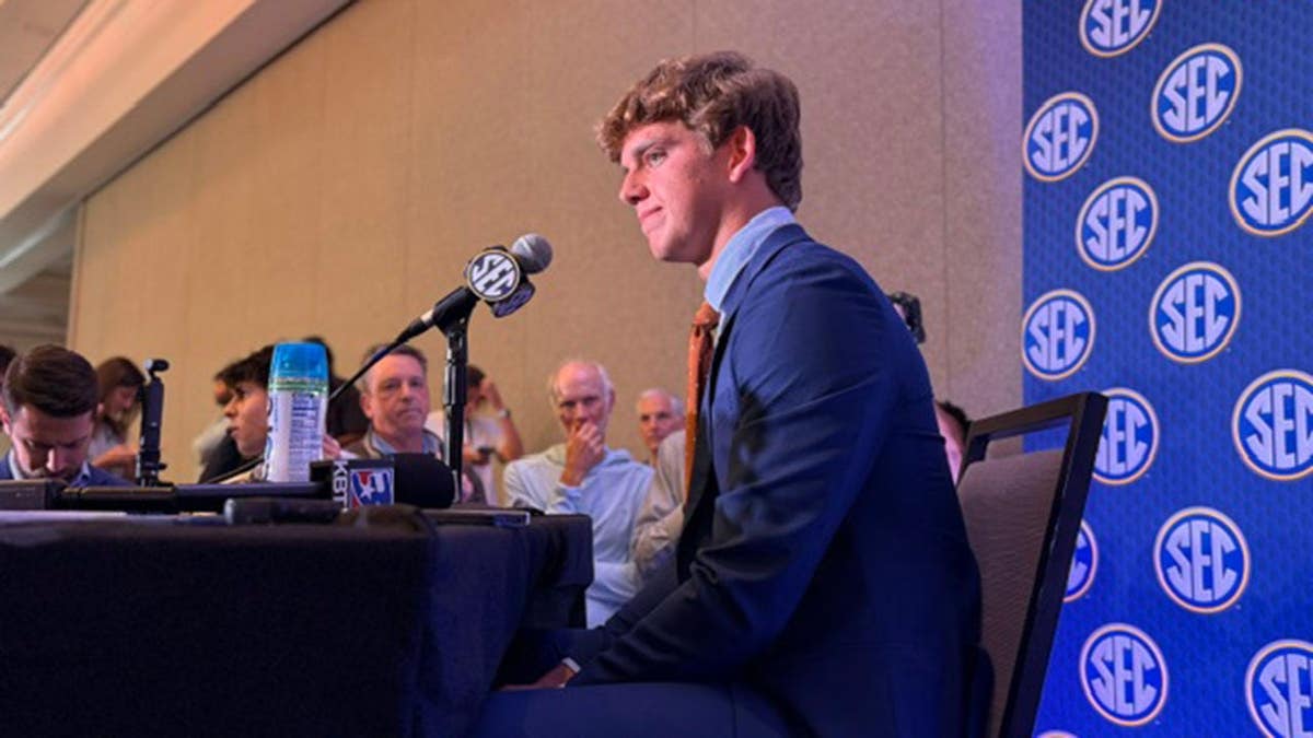 Arch Manning visits with reporters at SEC Media Days in Tampa, Florida