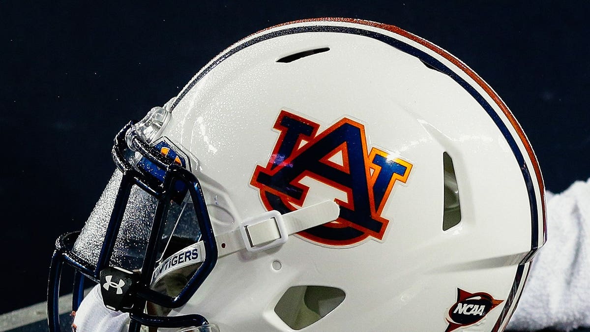 Auburn Tigers helmet sitting on a bench