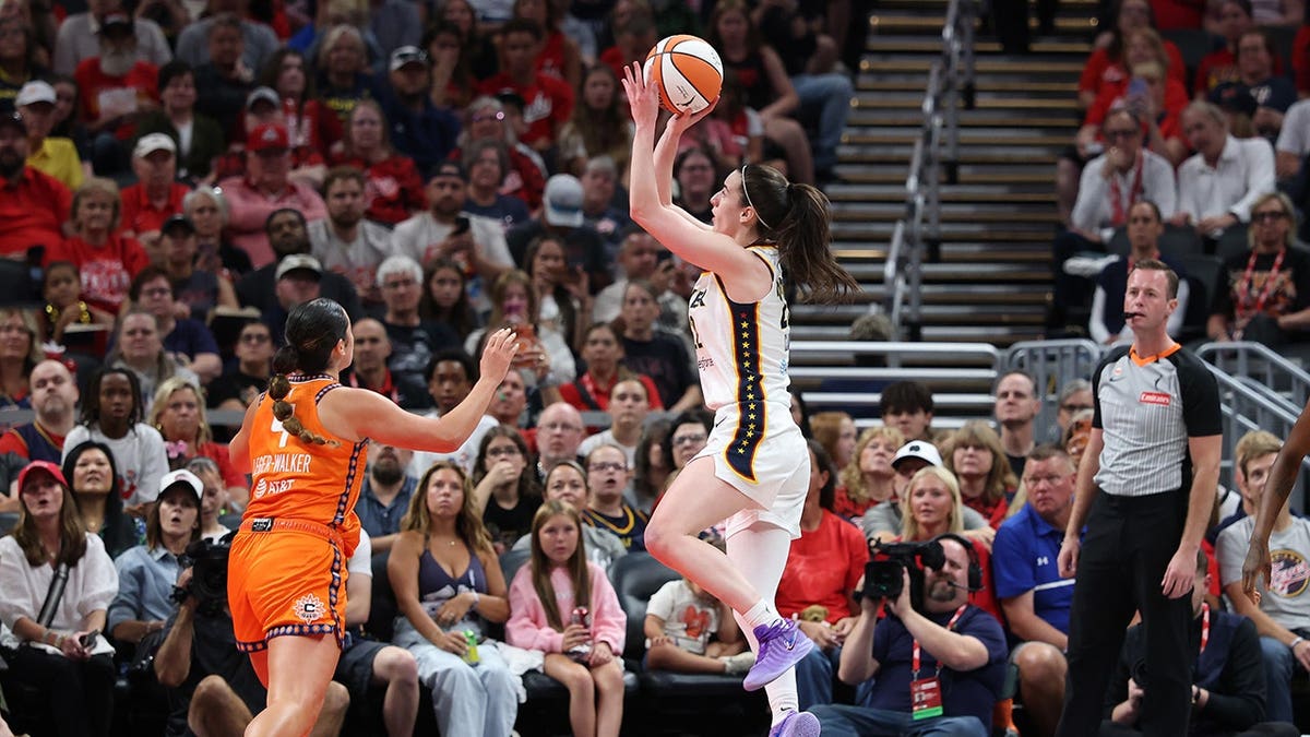Caitlin Clark shoots the ball during an Indiana Fever game