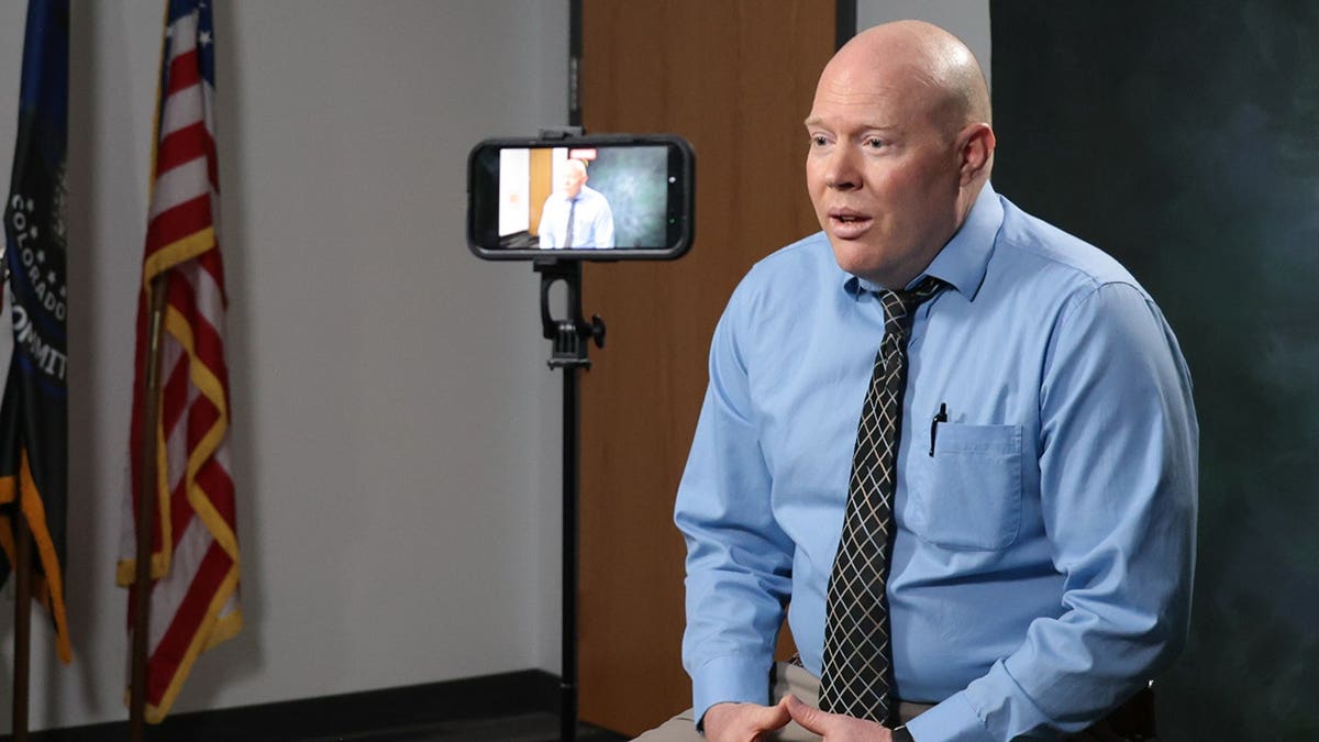 Aurora Police Department cold case detective Jason McDonald speaks in an interview for 