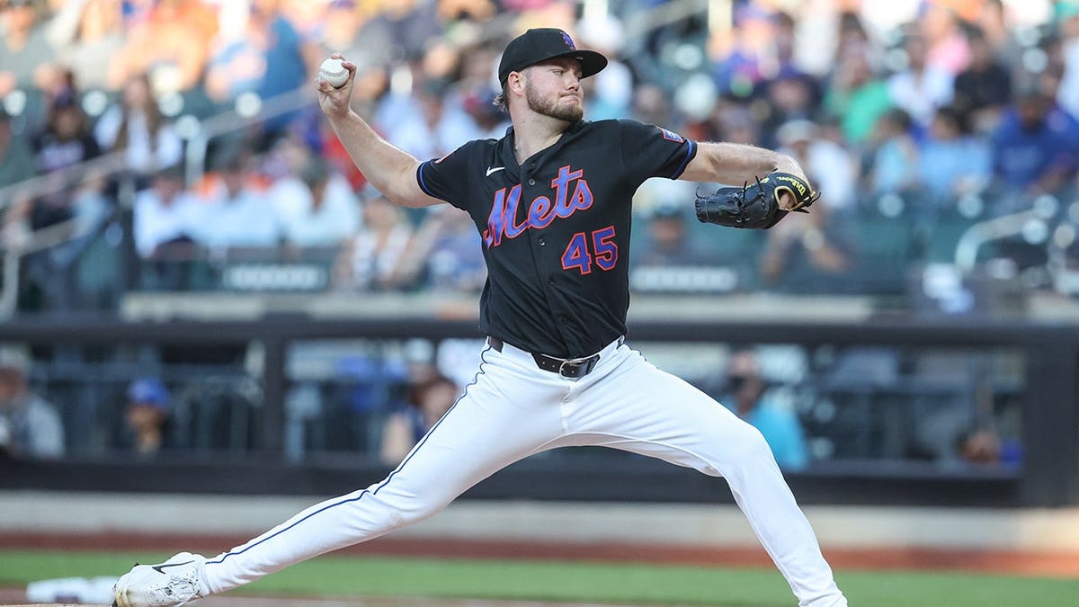 Christian Scott pitches in the first inning at Citi Field.