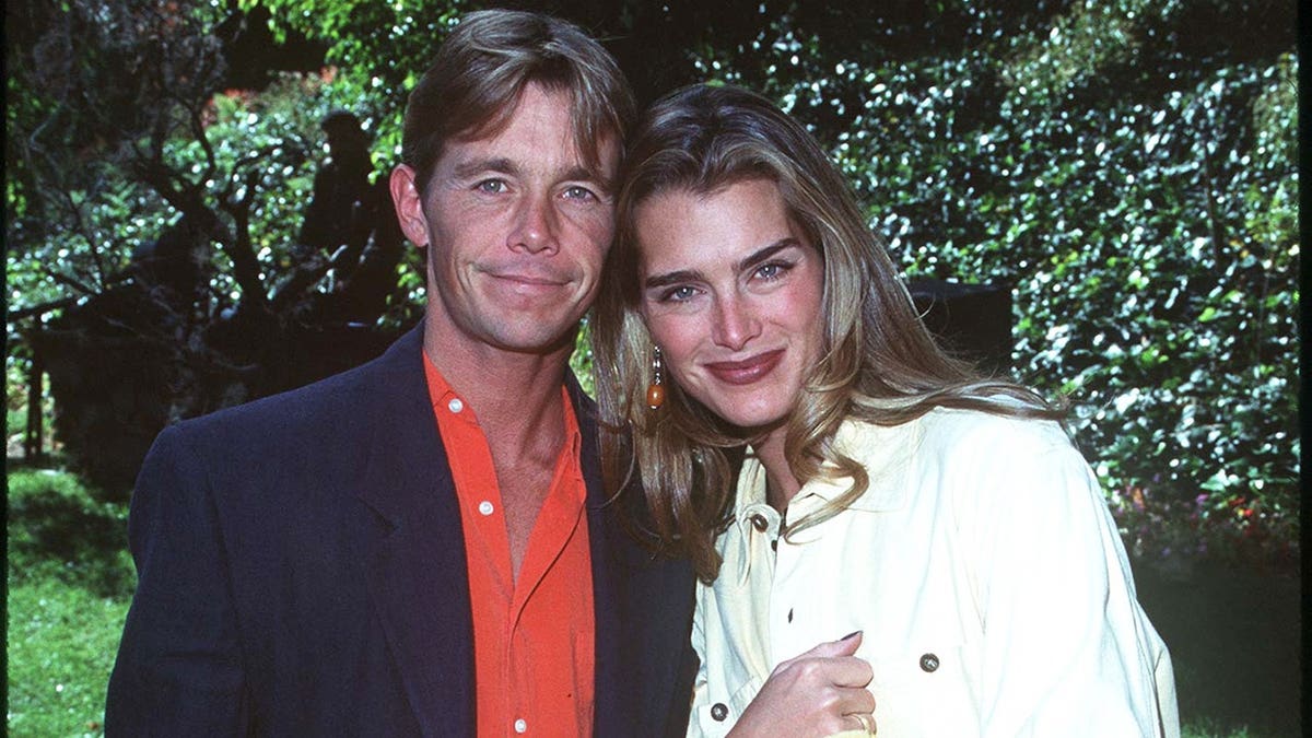 Brooke Shields and Chris Atkins pose at a Halloween event in Beverly Hills.
