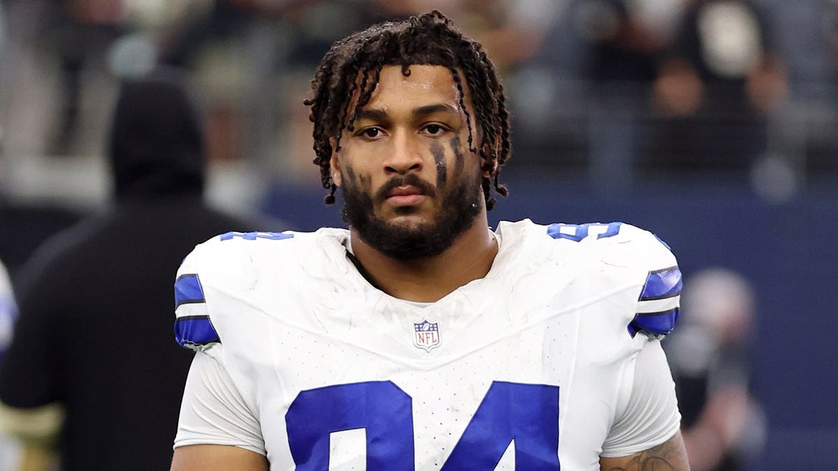 Marshawn Kneeland walks off field