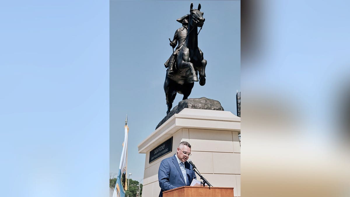 Matthew Taylor with Caesar Rodney statue.