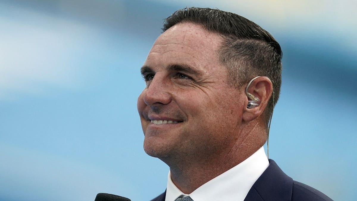 Jay Feely stands connected nan sideline astatine SoFi Stadium.