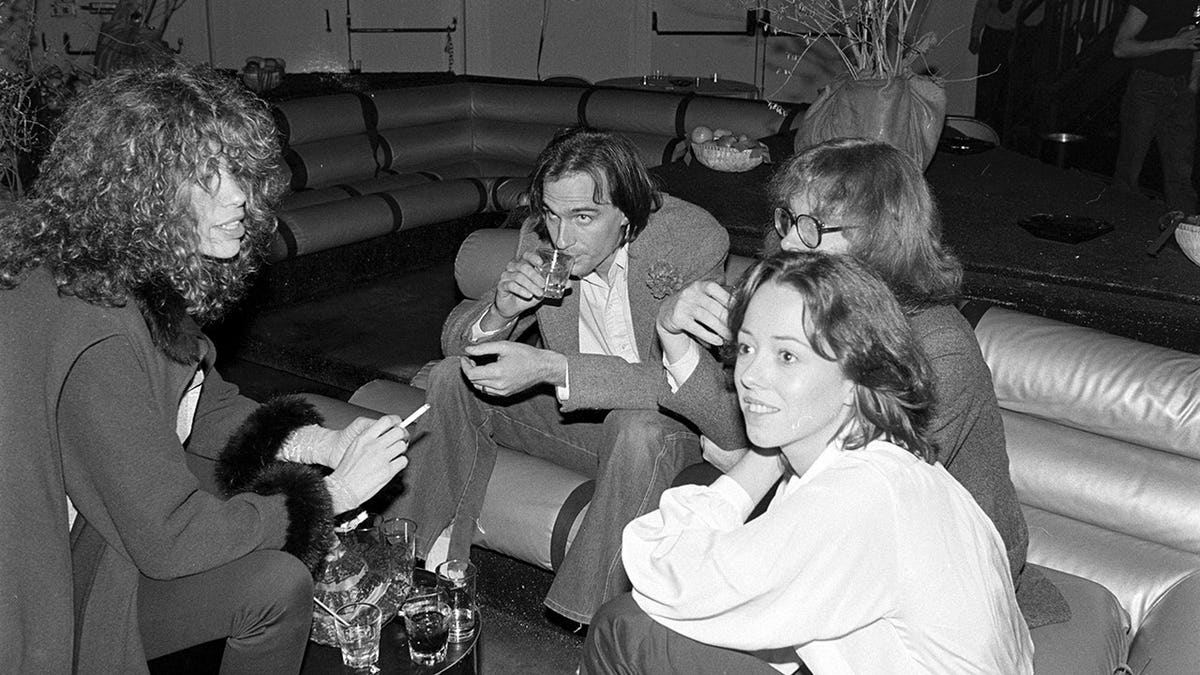 Cary Simon, James Taylor, Mackenzie Phillips and Peter Asher stand at a party in Studio 54.