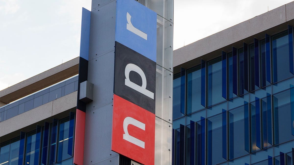 NPR logo displayed on a sign outside headquarters in Washington, D.C.