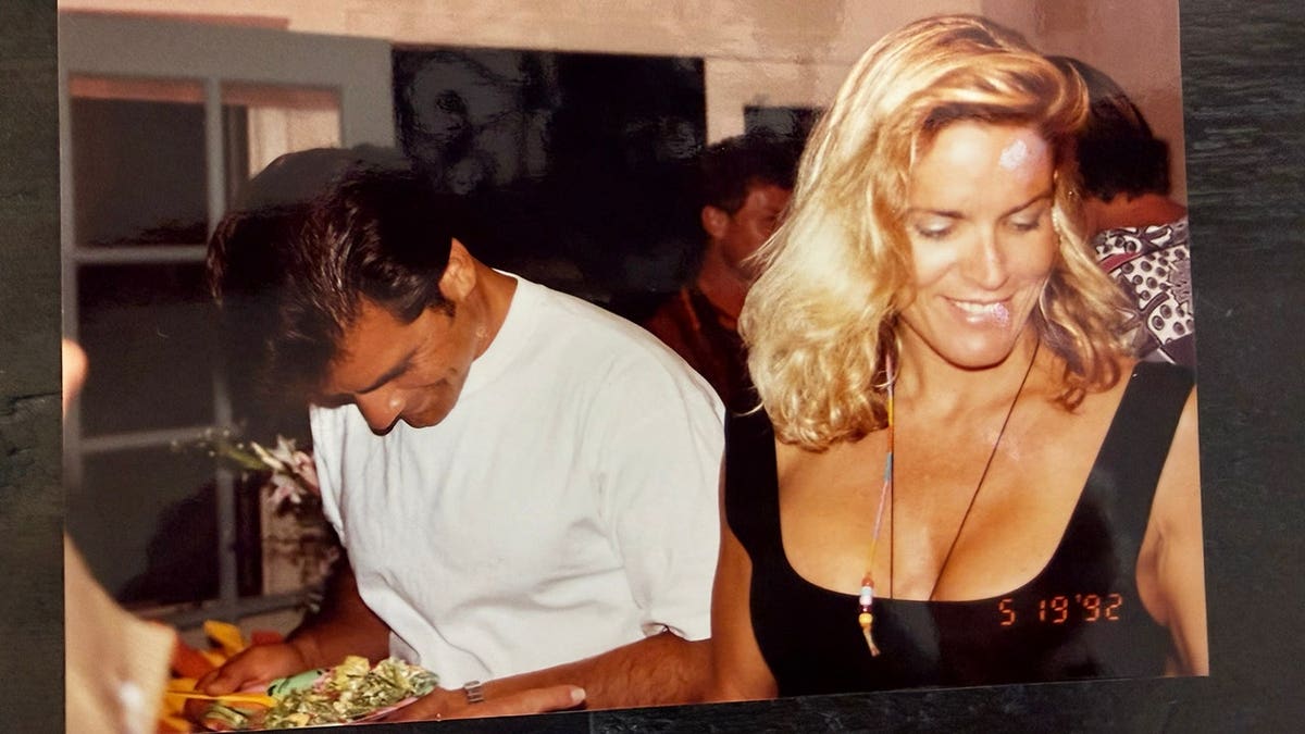Joseph Perrulli looking down as Nicole Brown Simpson smiles and looks away.