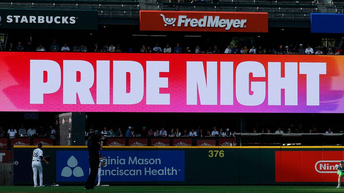 Pride Night signs on the center field and LED board at T-Mobile Park.