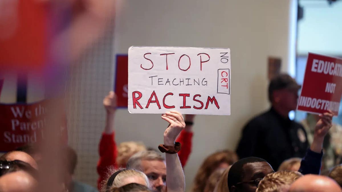 Opponents of Critical Race Theory attend a packed Loudoun County School Board meeting in Ashburn, Virginia.