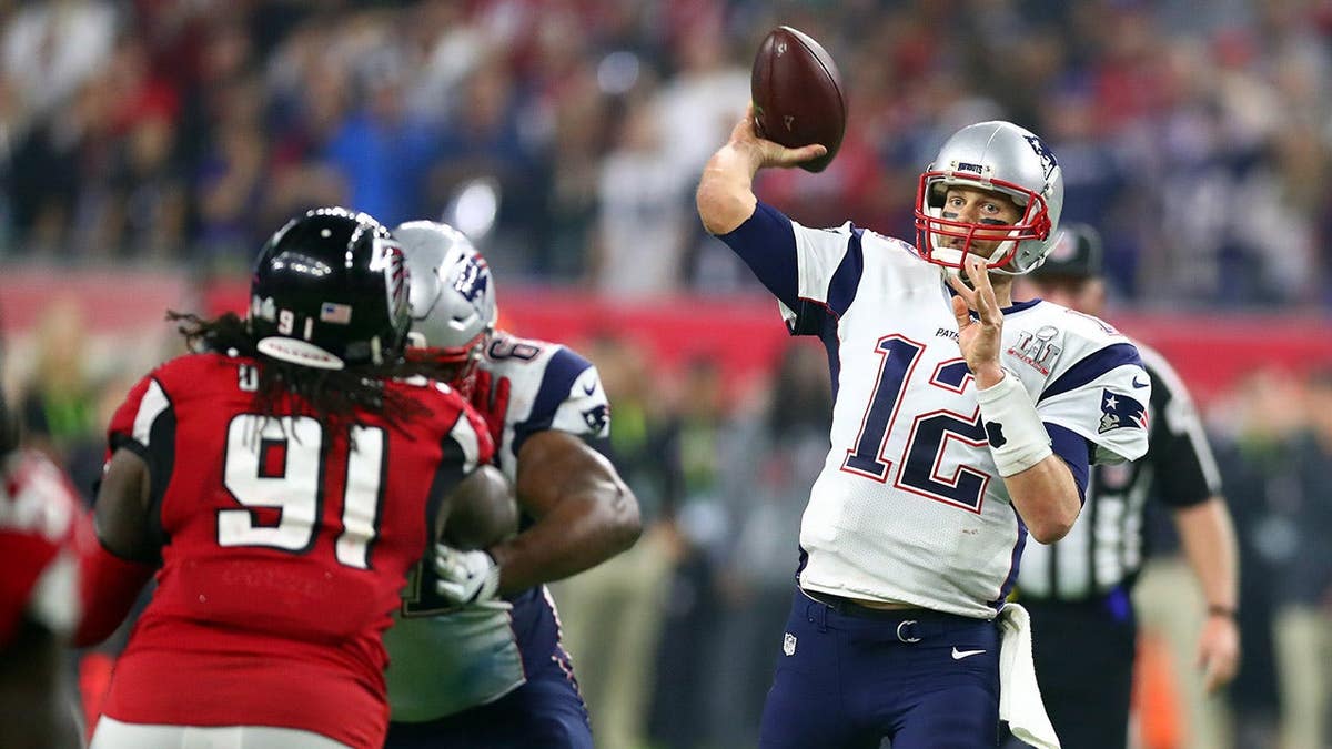 Feb 5, 2017; Houston, TX, USA; New England Patriots quarterback Tom Brady (12) throws a pass against the Atlanta Falcons in overtime during Super Bowl LI at NRG Stadium. Mandatory Credit: Mark J. Rebilas-USA TODAY Sports
