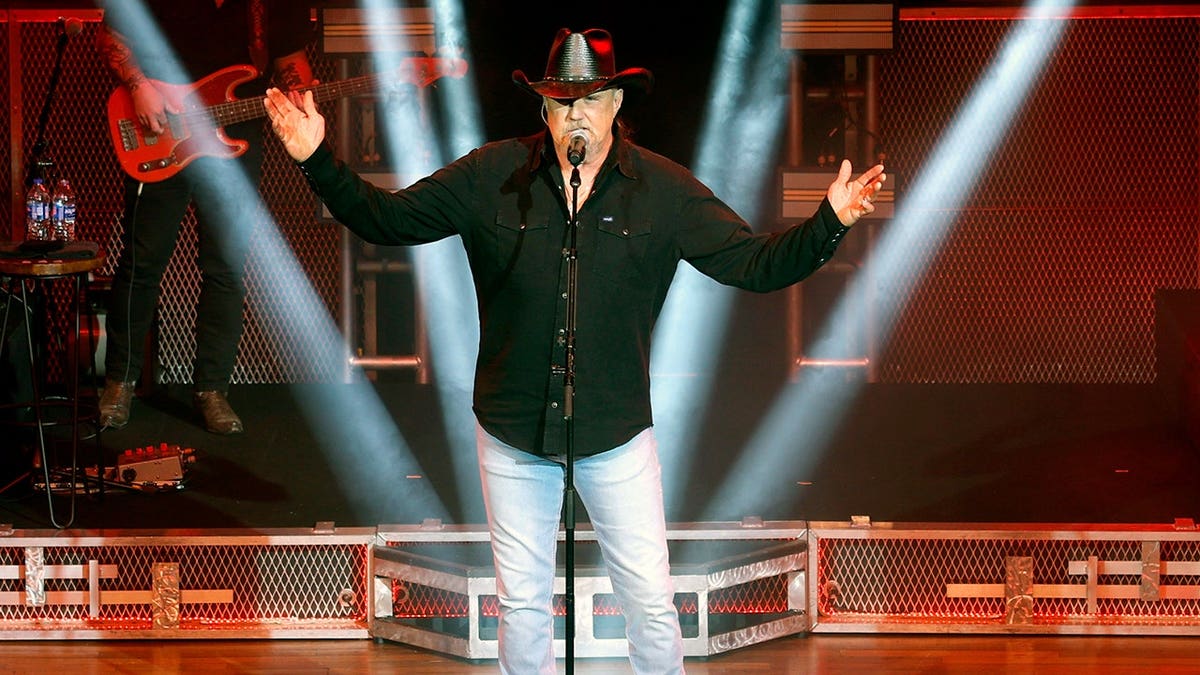 Trace Adkins gestures to the crowd