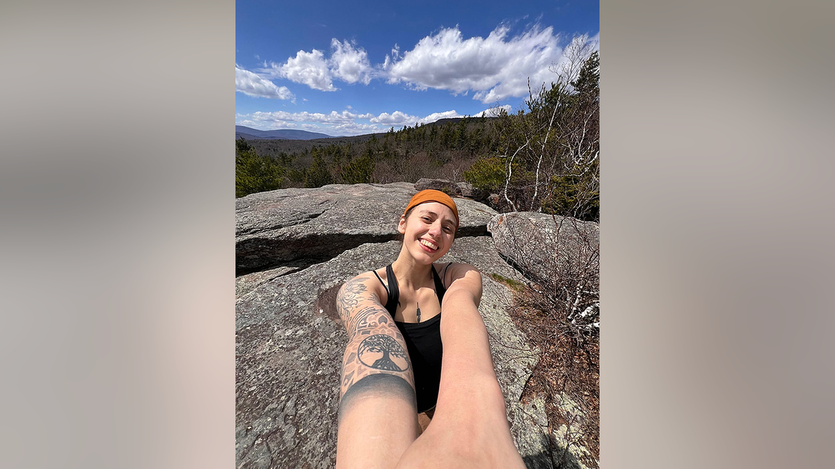 Victoria Castle smiles during a hiking trip in an undated selfie