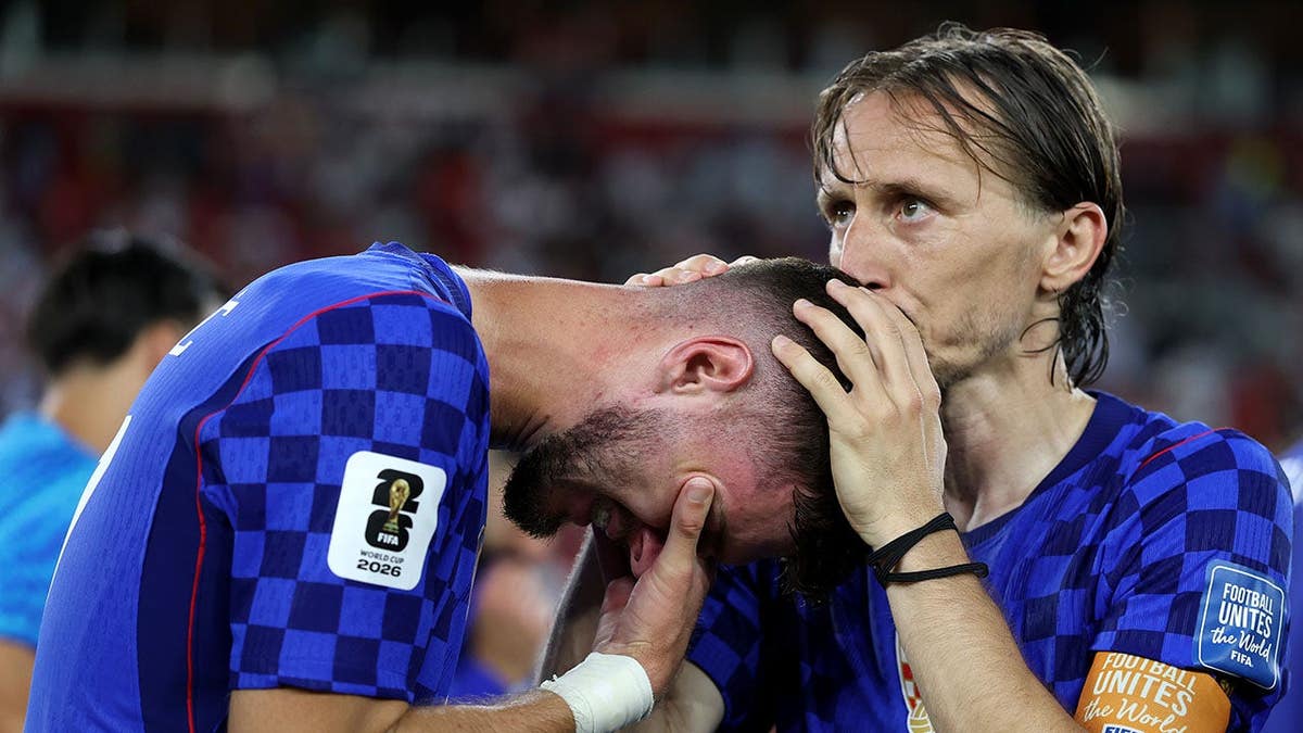 Mateo Kovacic #8 and Luka Modric #10 of Croatia react after the 1-2 loss during the FIFA World Cup