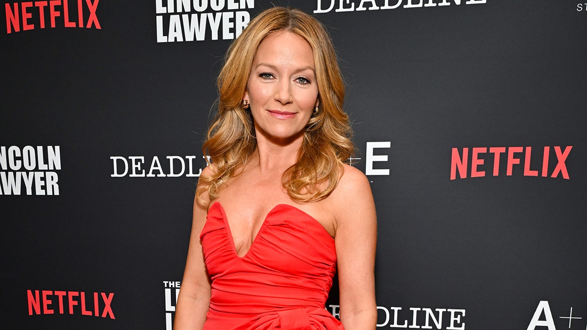 Becki Newton posing at the Deadline x "The Lincoln Lawyer" Season 4 Premiere Celebration.