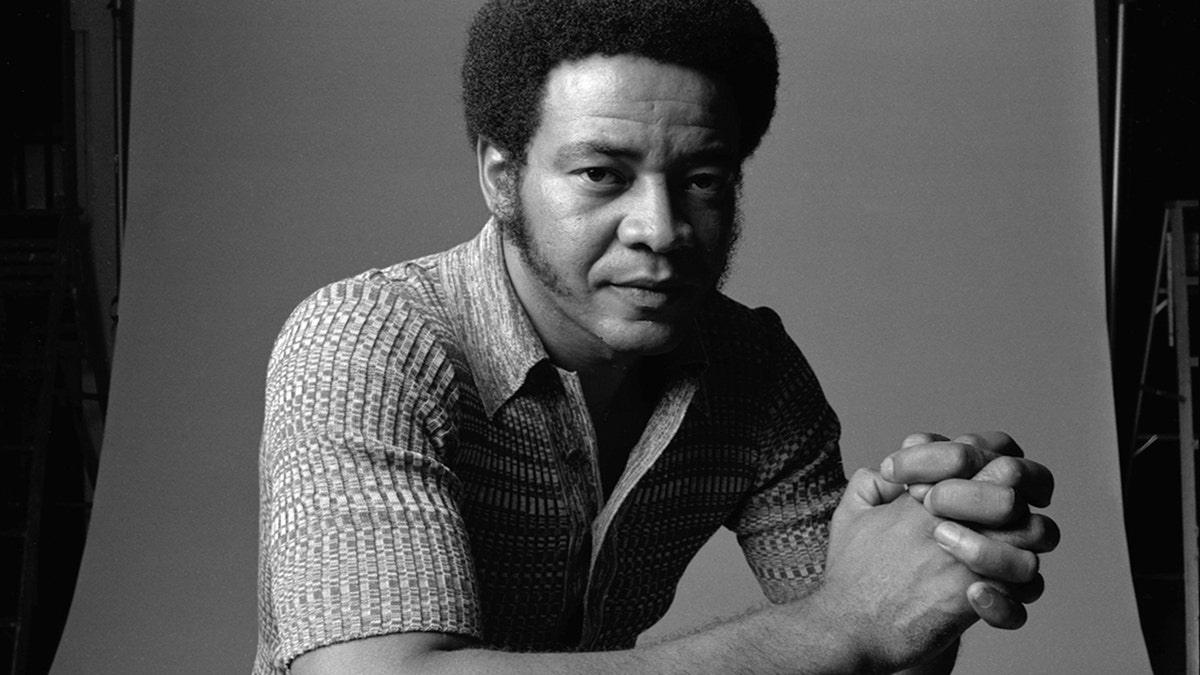 Bill Withers looking toward the camera during a studio portrait session.