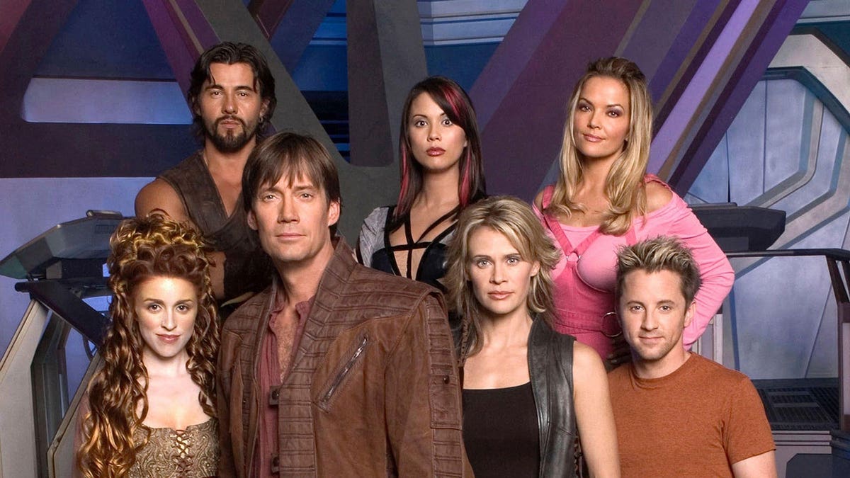 Brandy Ledford and Kevin Sorbo stand together in a scene from Andromeda.