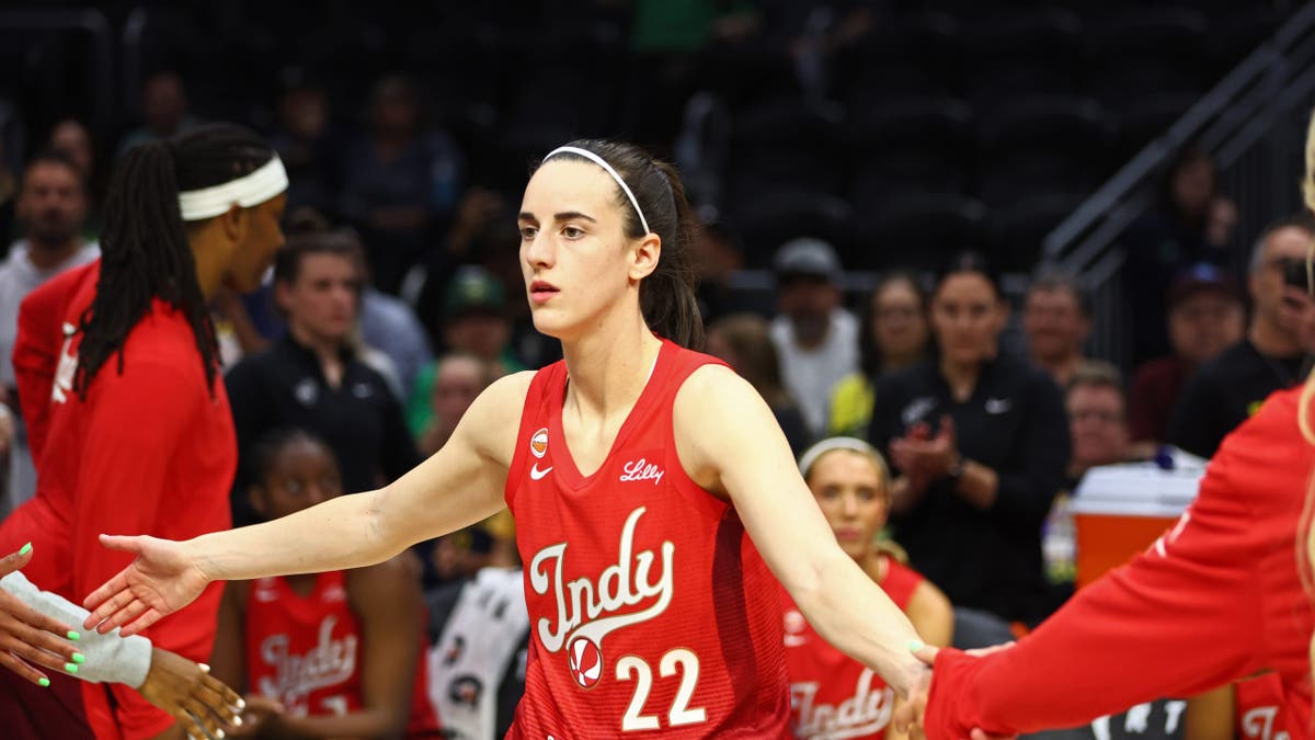 Caitlin Clark stands on the court before the Indiana Fever game