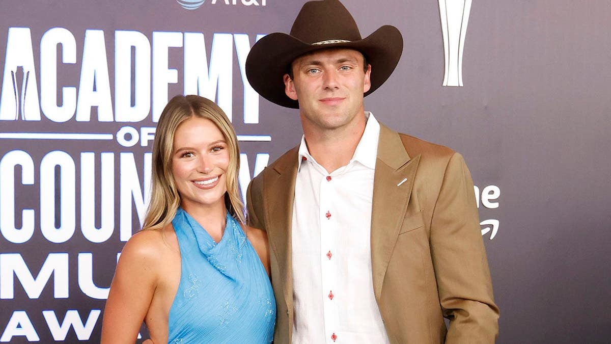 Cameron Rose Newell and Brock Bowers attend the 2026 ACM Awards at MGM Grand Garden Arena in Las Vegas.