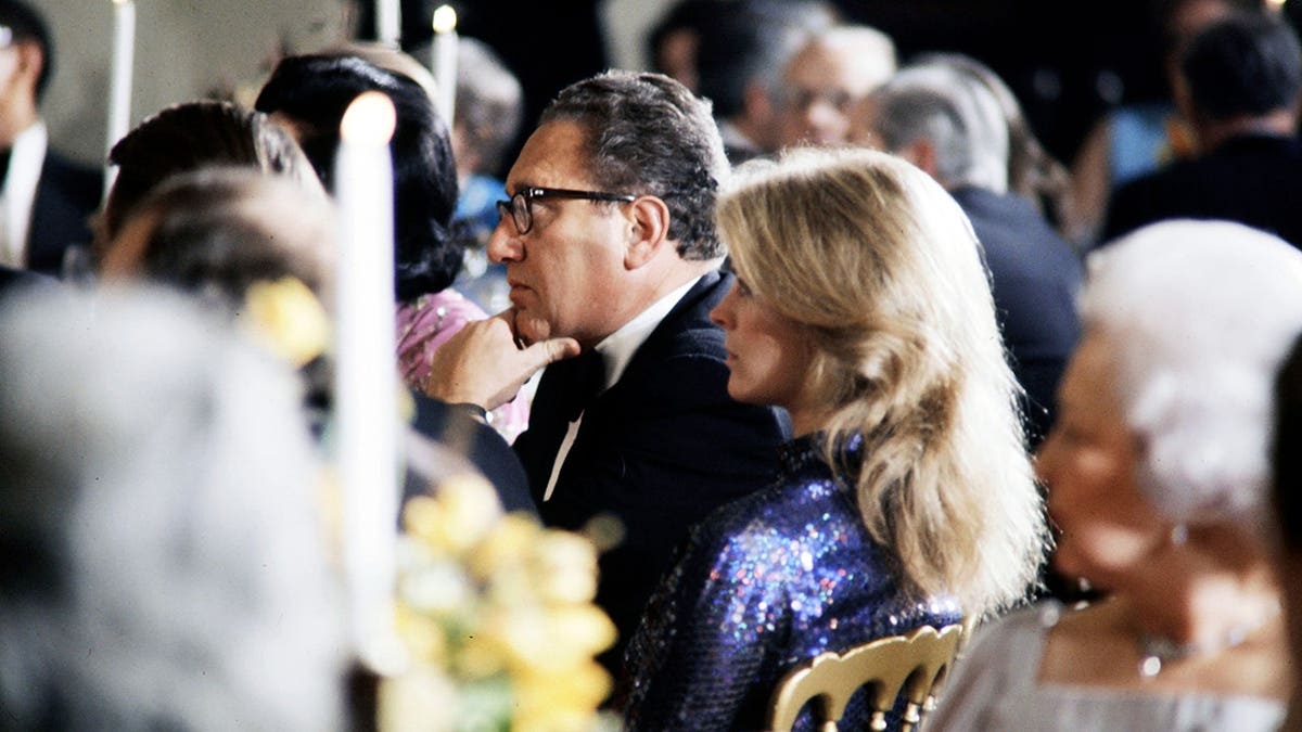 Henry Kissinger and Candice Bergen are seen together at a dinner