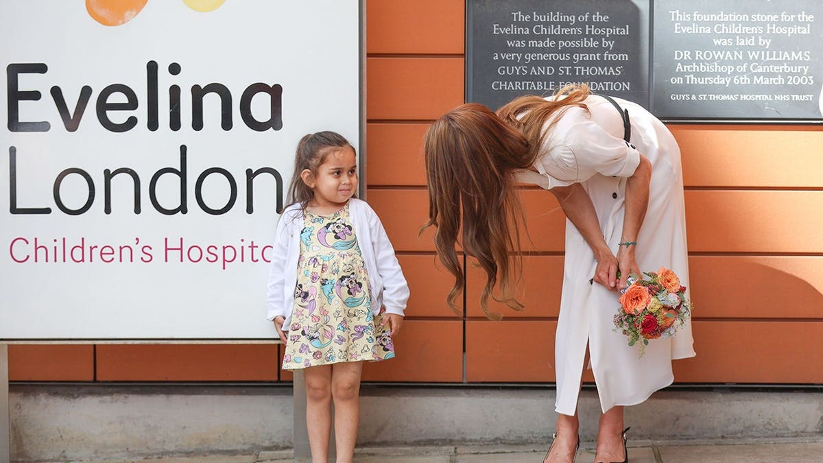 Catherine, Princess of Wales, leaves Evelina London Children's Hospital holding a bouquet.