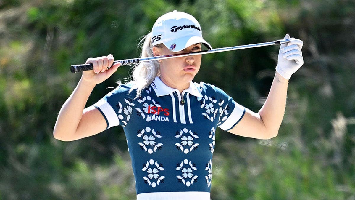 Charley Hull of England reacts arsenic she prepares to play a changeable connected nan 3rd hole.