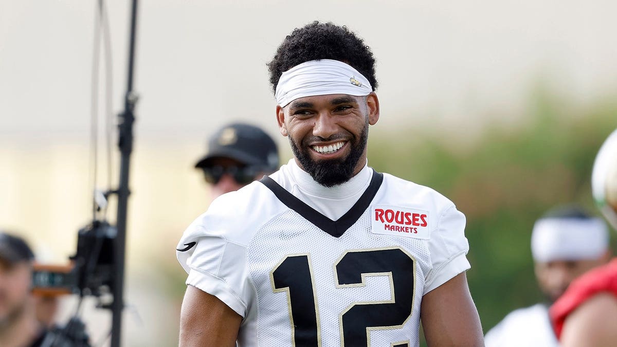 Chris Olave #12 reacts during New Orleans Saints training camp.