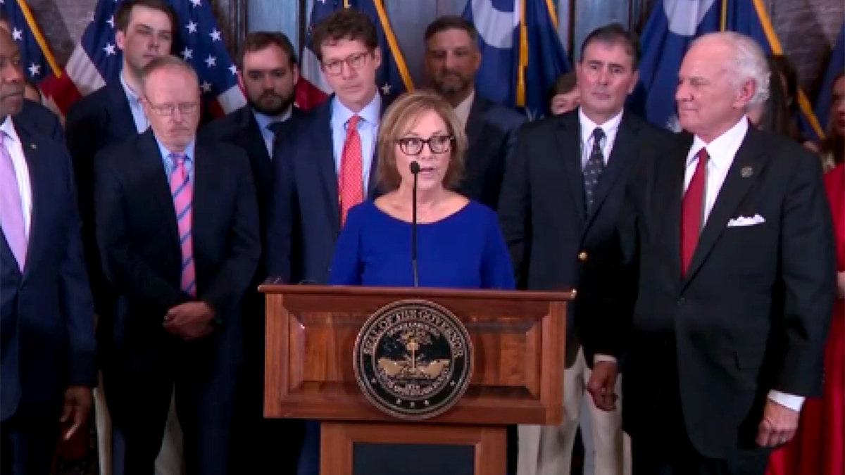 Darlene Graham speaks from a microphone.