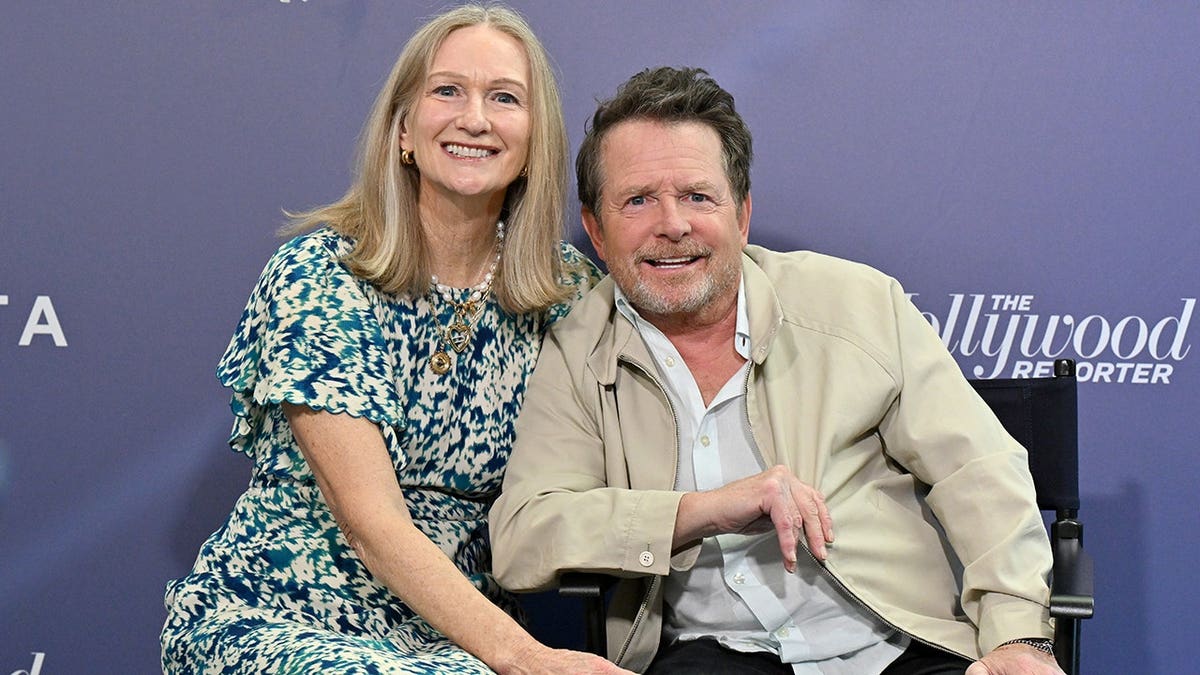 Deborah W. Brooks and Michael J. Fox at the Social Impact Summit in Los Angeles in July 2026.