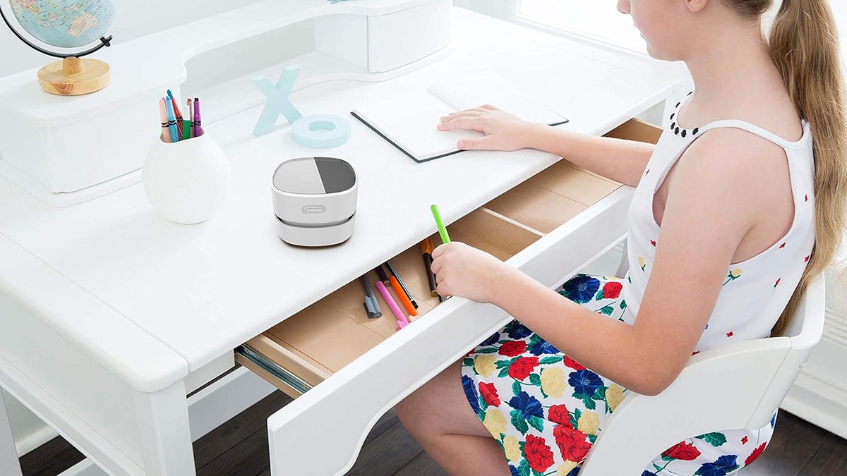 Clean crumbs and other messes off your desktop.