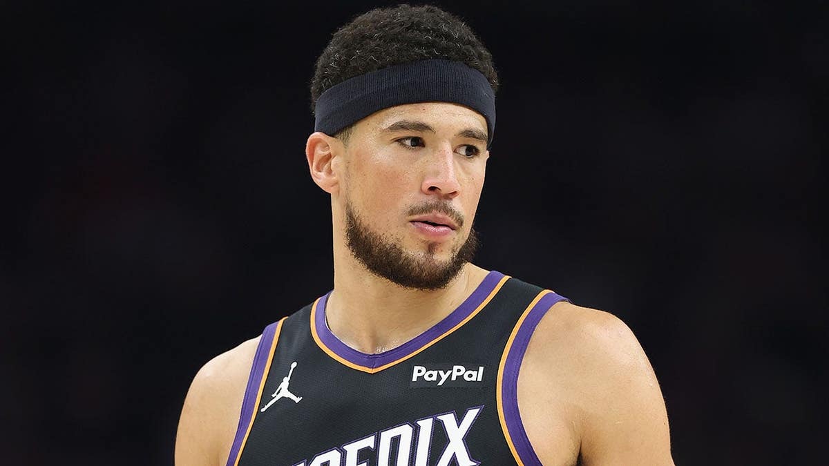 Devin Booker of the Phoenix Suns plays during an NBA play-in tournament game.