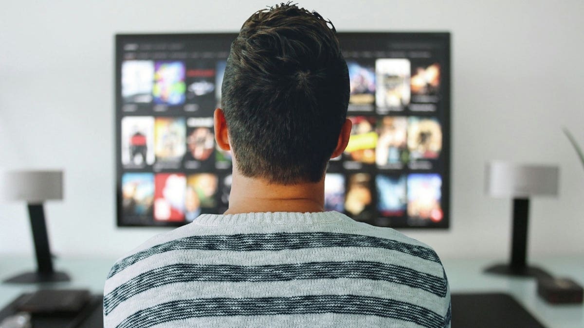 A man watching TV