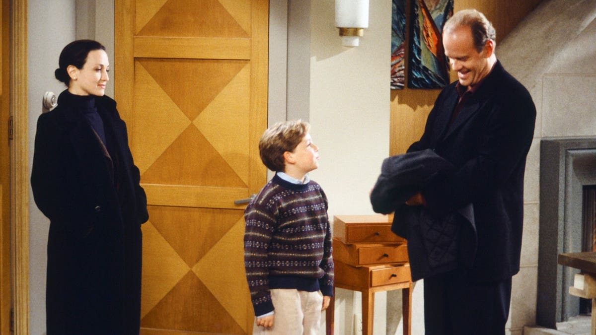 Bebe Neuwirth as Dr. Lilith Sternin, Trevor Einhorn as Frederick Crane and Kelsey Grammer as Dr. Frasier Crane stand together.