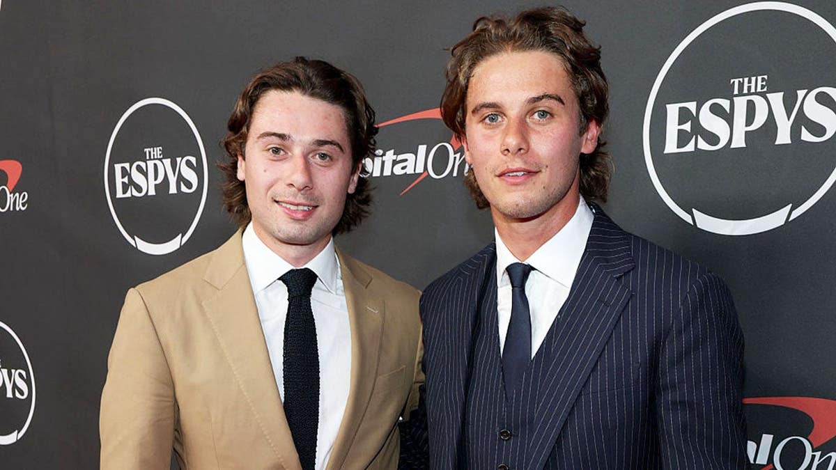 Quinn Hughes and Jack Hughes stand together at the ESPY Awards in New York City.