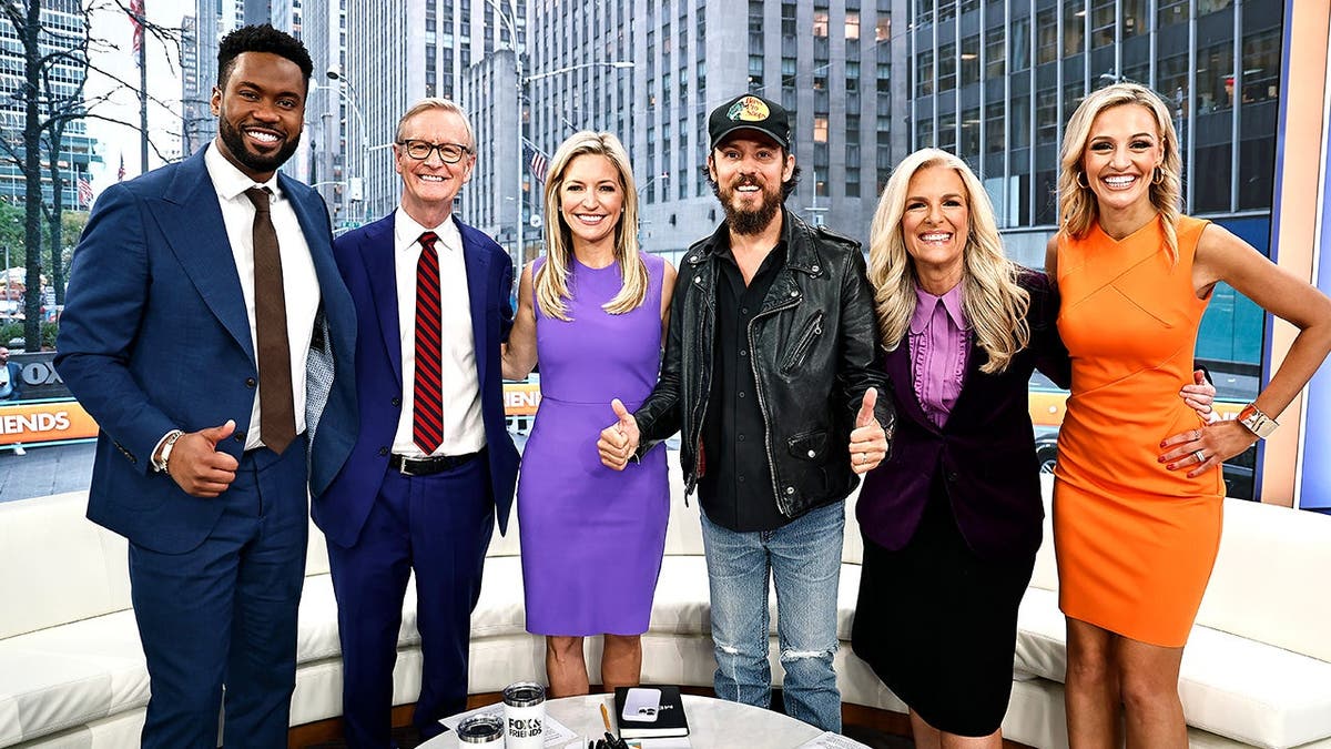 'Fox & Friends' hosts pose with country singer Chris Janson.