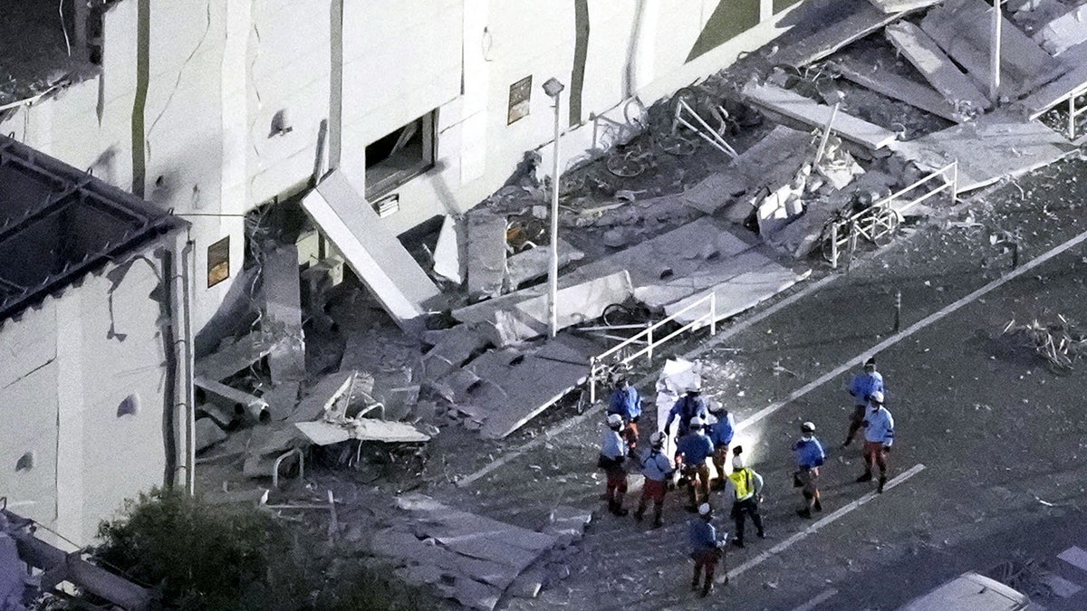 An aerial view shows rescue workers conducting a search and rescue operation at the damaged Aeon Mall shopping centre, where, according to local media, an explosion occurred after an earthquake with a preliminary magnitude of 7.1 struck Japan's southern Kumamoto prefecture, in Kashima Town, Kumamoto Prefecture, Japan, July 28, 2026. Kyodo/via REUTERS ATTENTION EDITORS - THIS IMAGE HAS BEEN SUPPLIED BY A THIRD PARTY. MANDATORY CREDIT. JAPAN OUT. NO COMMERCIAL OR EDITORIAL SALES IN JAPAN. TPX IMAGES OF THE DAY
