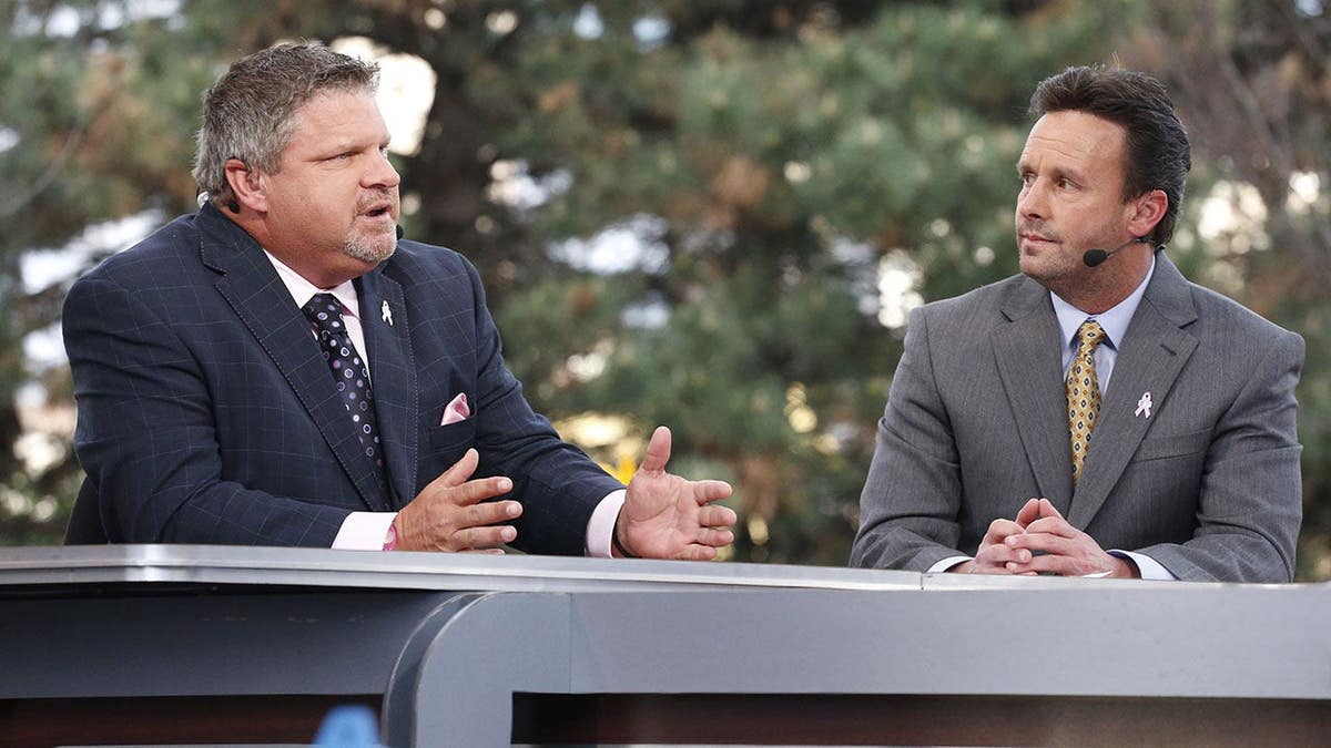 John Kruk and Karl Ravech stand on the Sunday Night Baseball pre-game set at PNC Park.