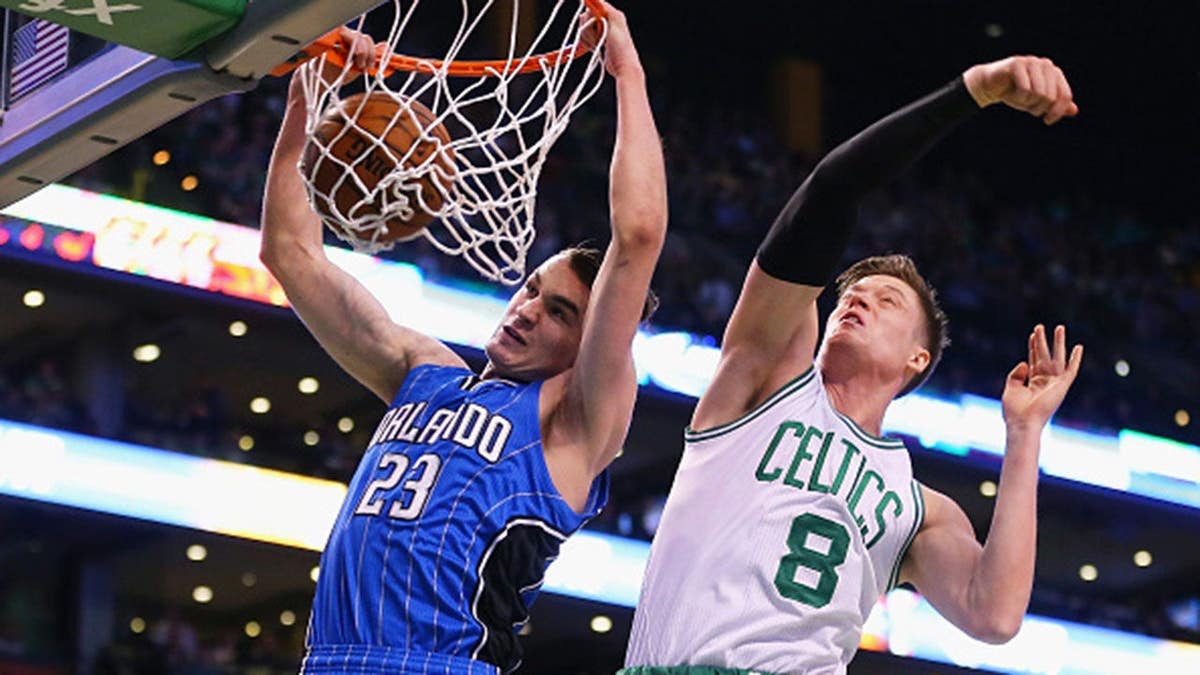 Jonas Jerebko of the Boston Celtics defends Mario Hezonja of the Orlando Magic during an NBA game.
