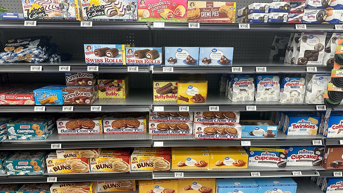 Little Debbie and Hostess snacks on store shelves.