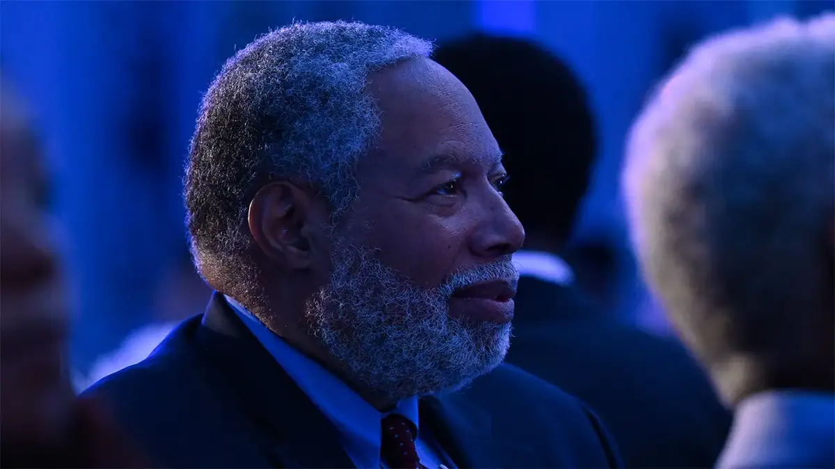 Lonnie Bunch sits in a dark room at an event in Atlanta, Georgia