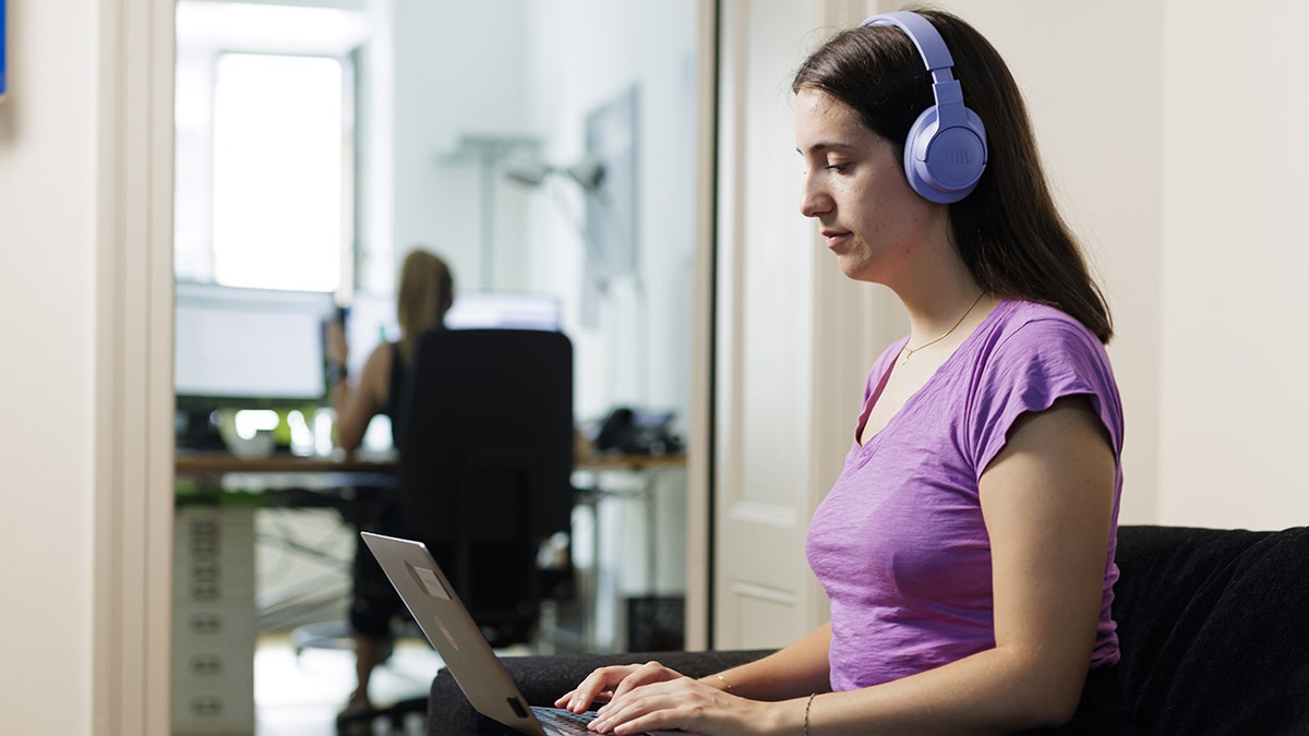 Woman on her computer.