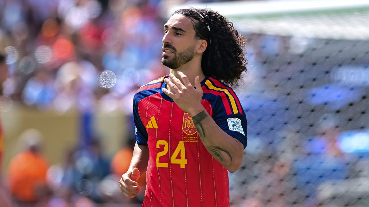 Spanish soccer player makes good on his promise to get tattoo of team's manager after World Cup win