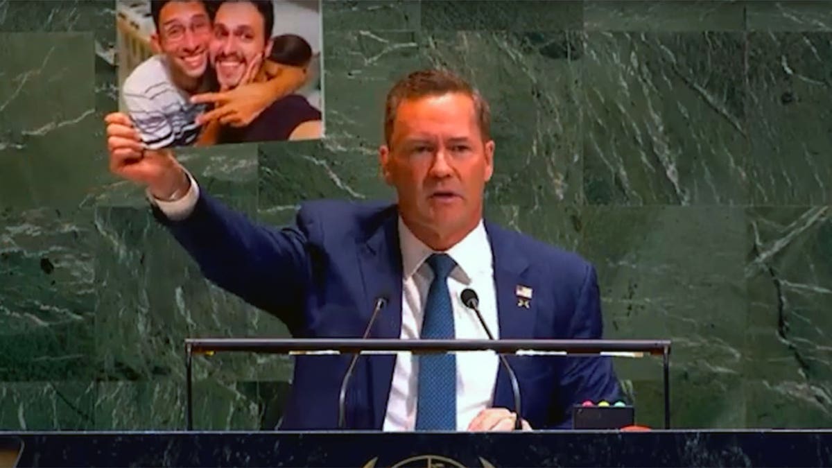 U.S. Ambassador to the United Nations Mike Waltz holds up a photograph of a jailed Cuban dissidents during a General Assembly debate on the U.S. embargo against Cuba at U.N. headquarters in New York on July 7, 2026.