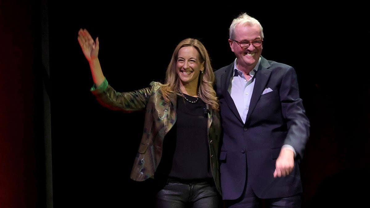 Mikie Sherrill and Phil Murphy greet the audience at New Jersey Performing Arts Center.
