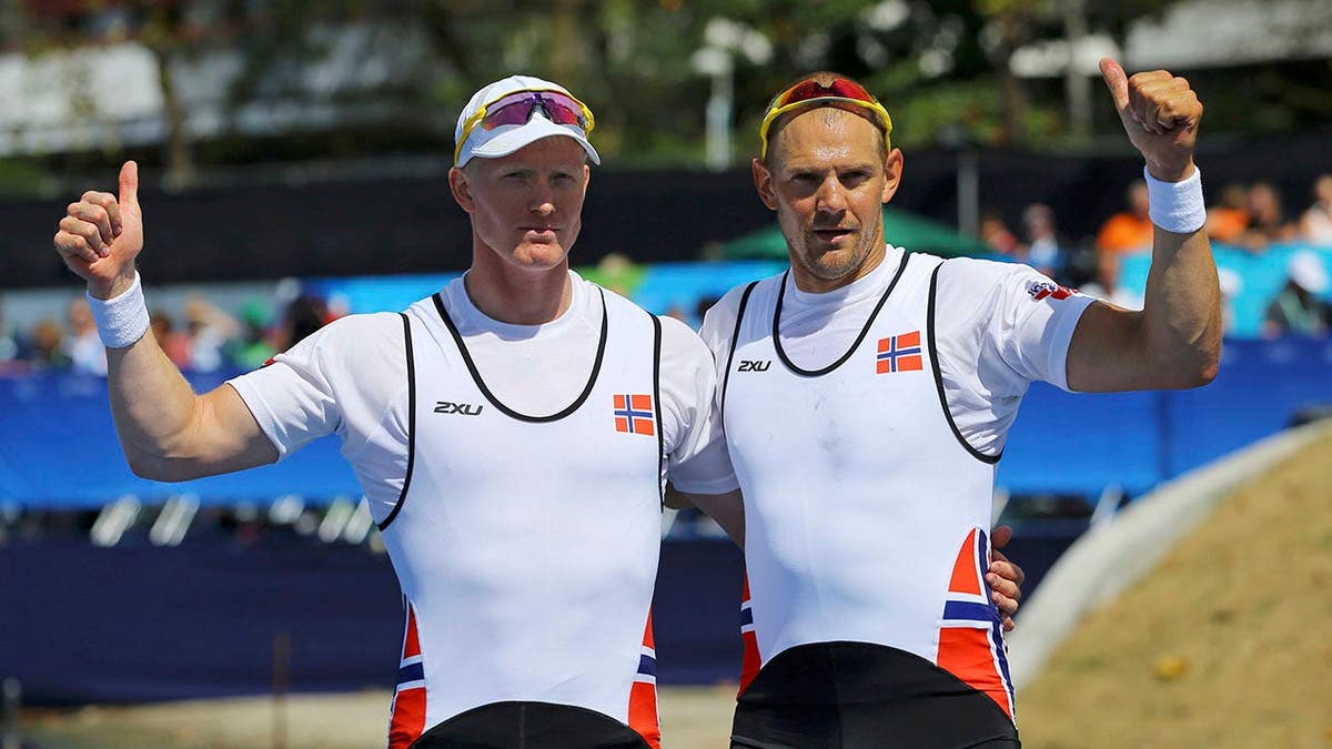 Kjetil Borch and Olaf Tufte celebrate after the men's double sculls final.