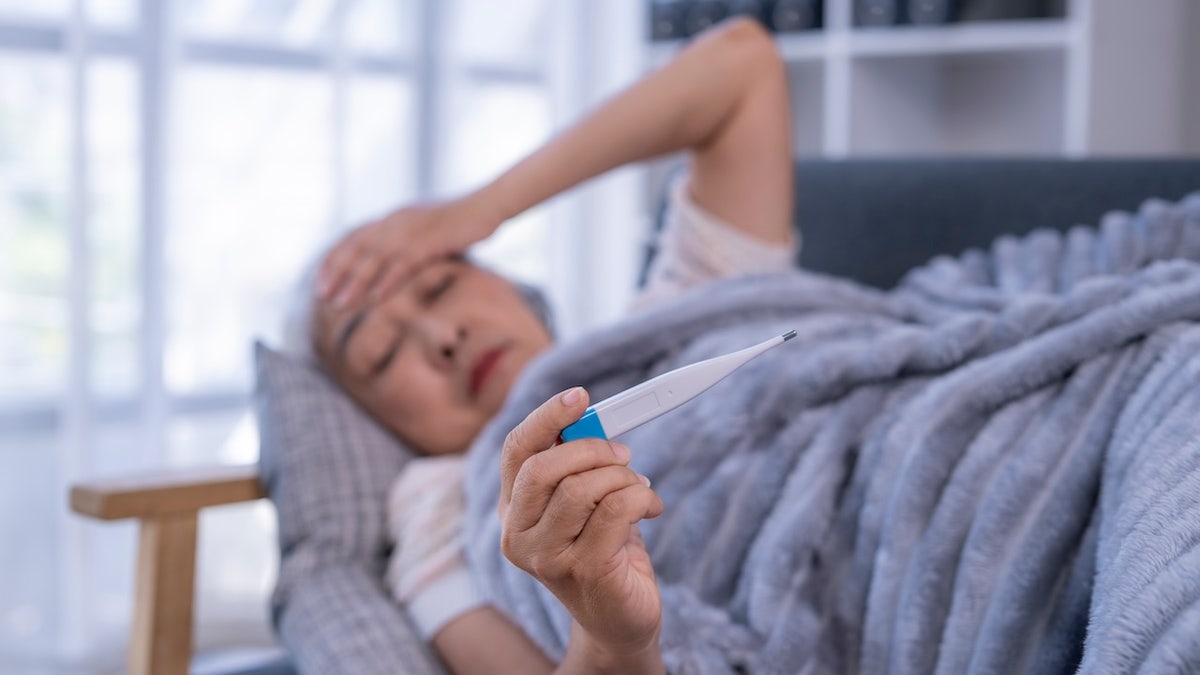 Older woman with flu