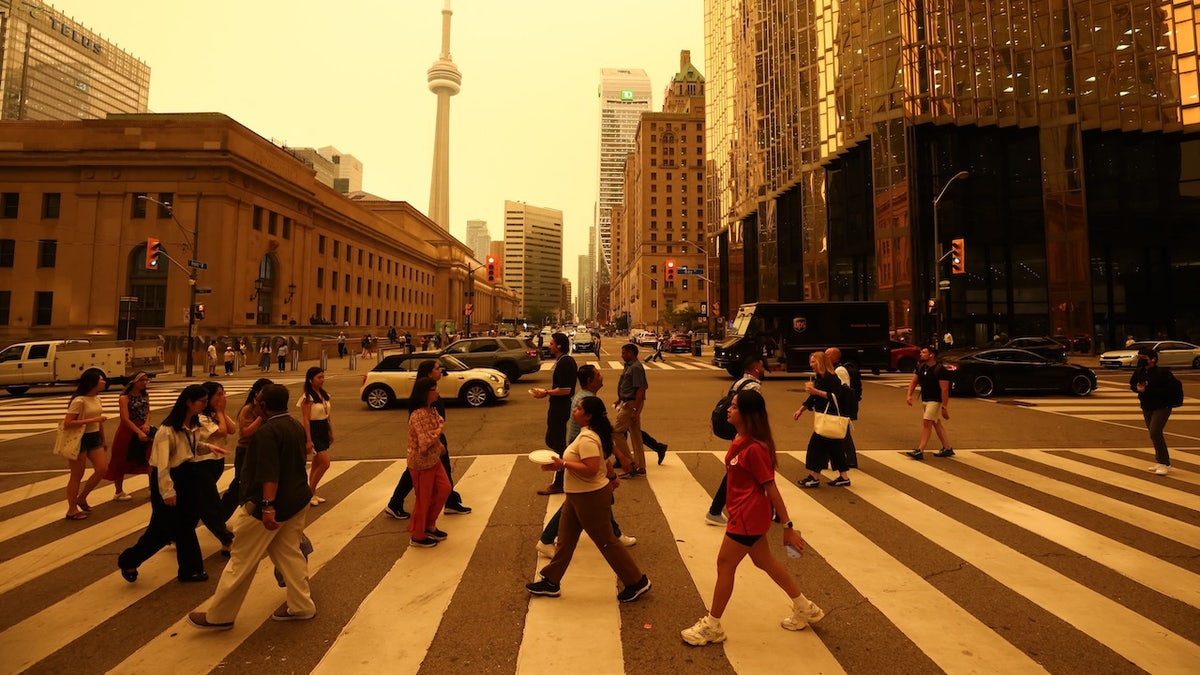Ontario wildfires - people crossing street